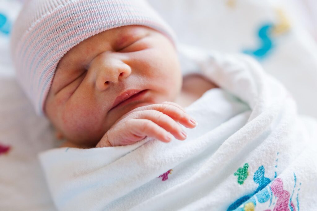 Raleigh Fresh 48 photographer capturing newborn baby in hospital bassinet