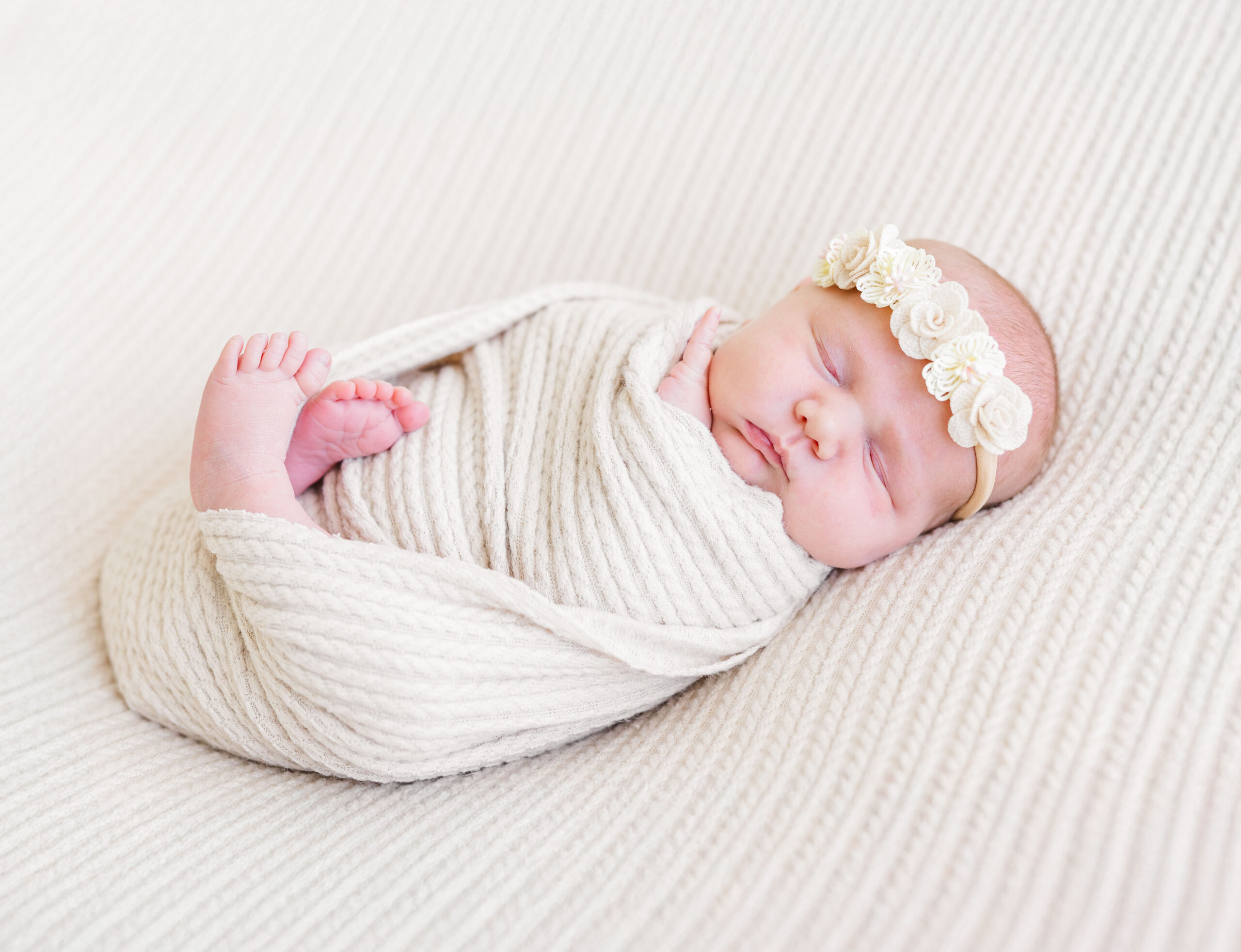 baby girl in cream wrap with boy