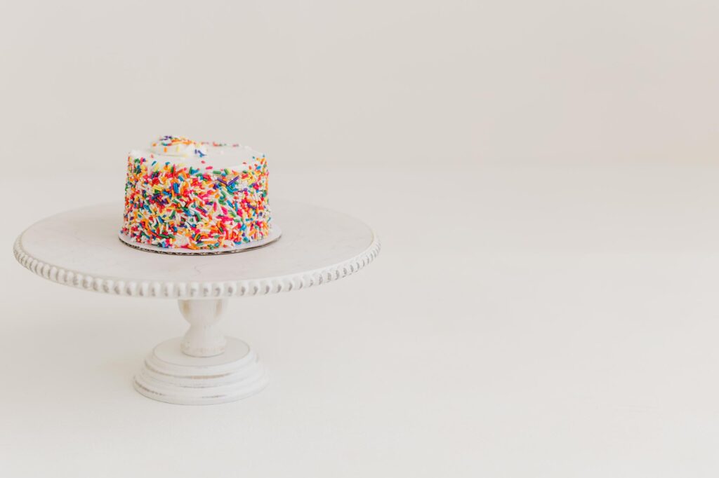 white cake with multi colored sprinkles
