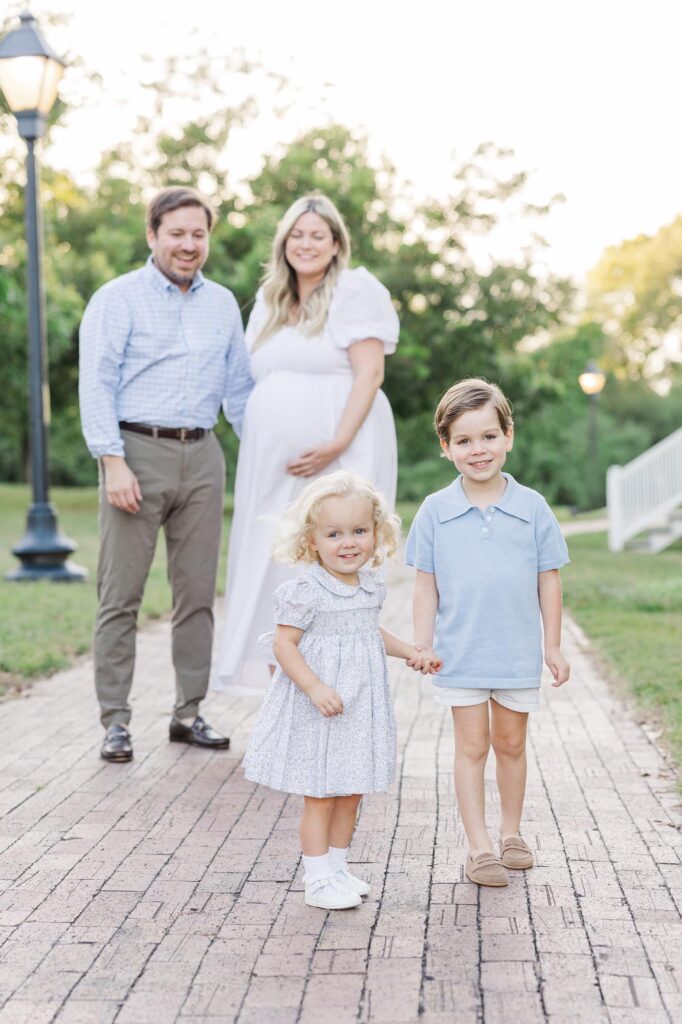 family walking on brick pathway during Raleigh spring mini sessions