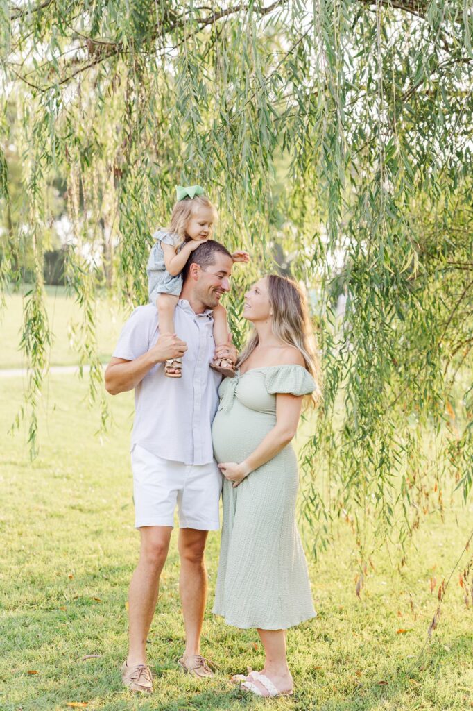 family portrait under willow tree during Raleigh spring mini sessions