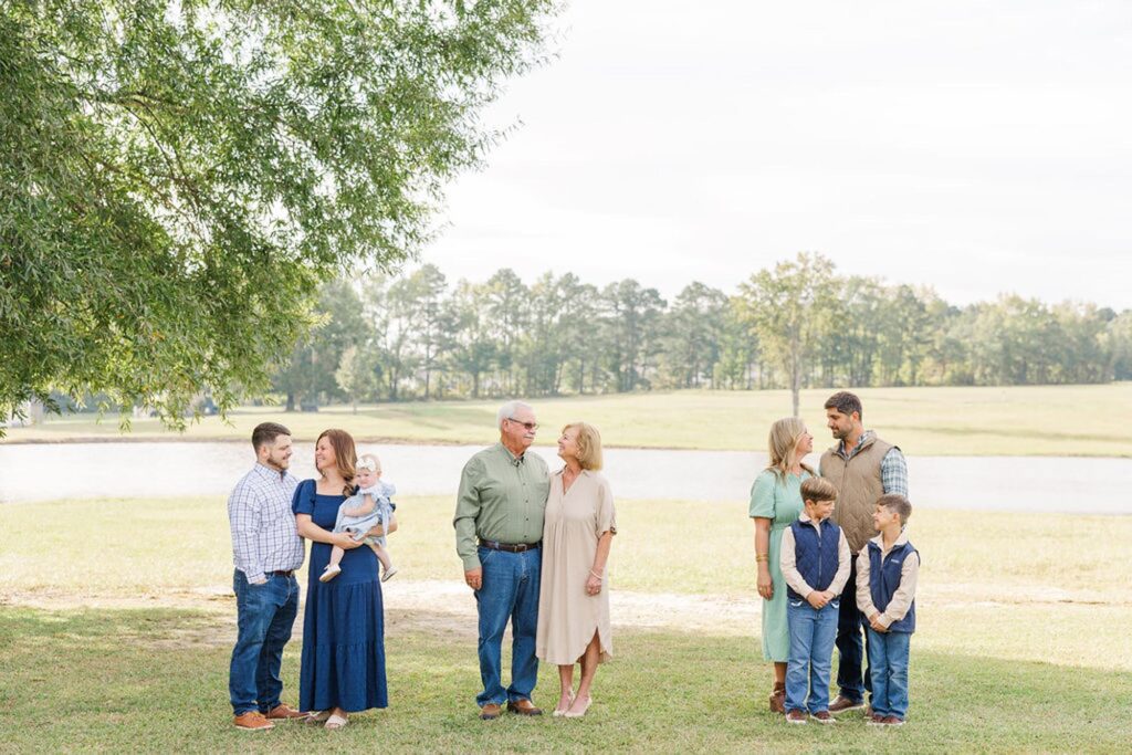 Three families looking at each other during their raleigh extended family photography session 