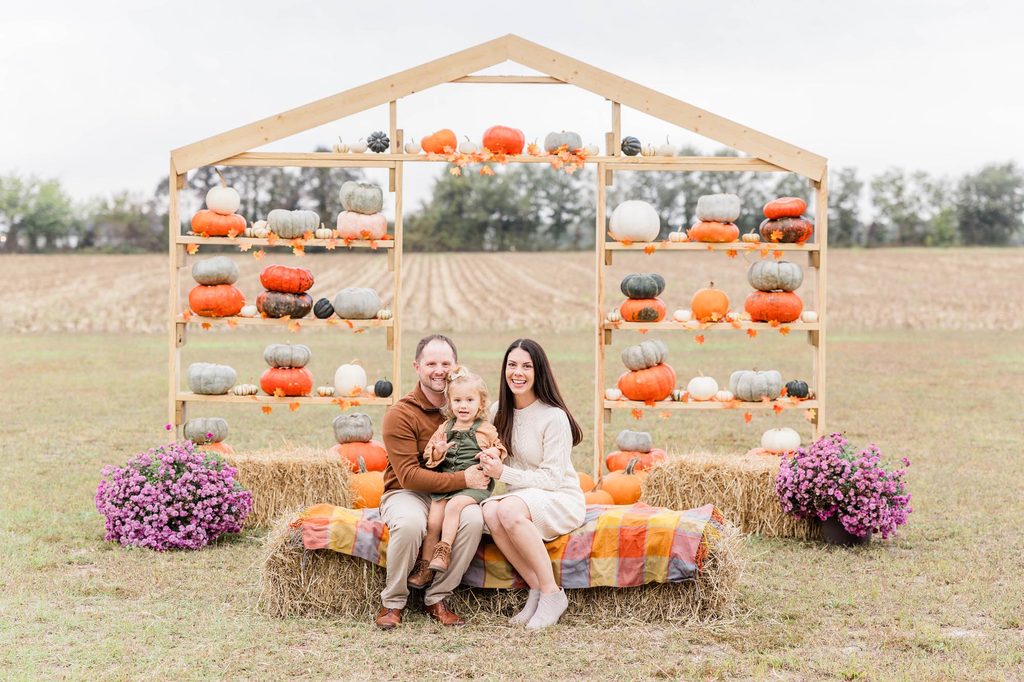 a family sitting for their pictures discussing the Best Fall Activities in Raleigh 